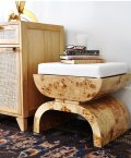 Burl wood bench with ivory linen upholstery lifestyle view.